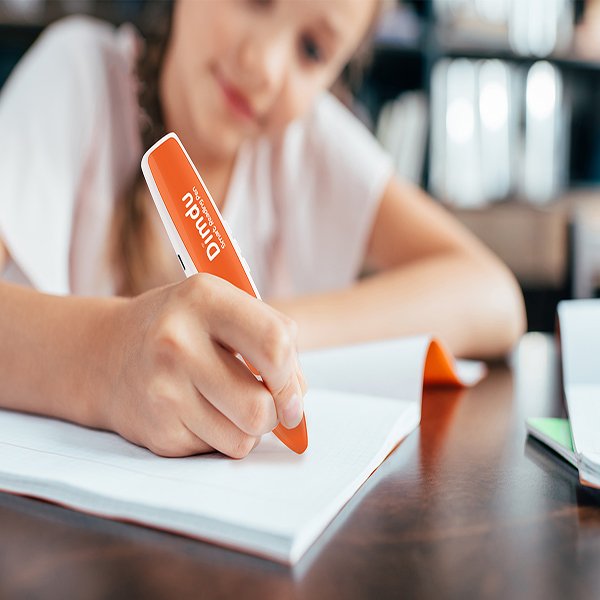 Children learning with OID interactive book and smart talking pen Children learning with OID interactive book and smart talking pen